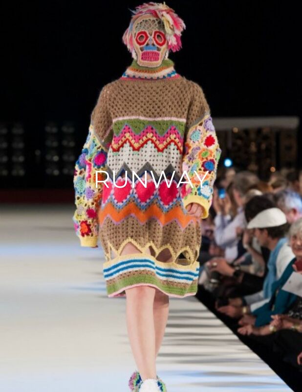 Model in knitted avant garde fashion on runway